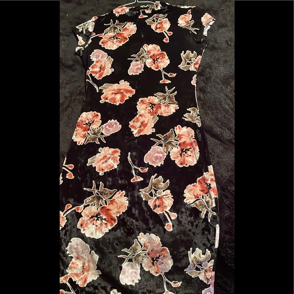 Medium length Black velvet rose dress.